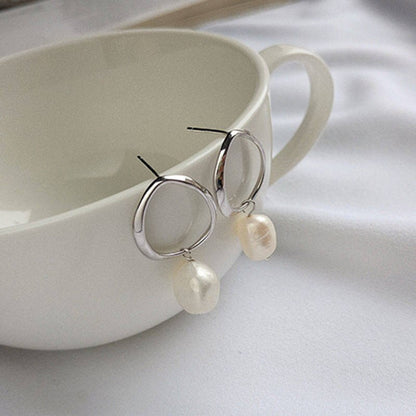 Boucles d'oreilles pendantes avec perles